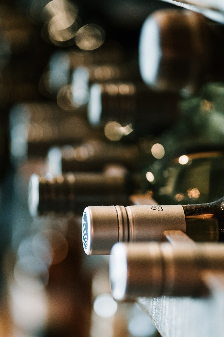 Rows of wine bottles resting in the castle cellar