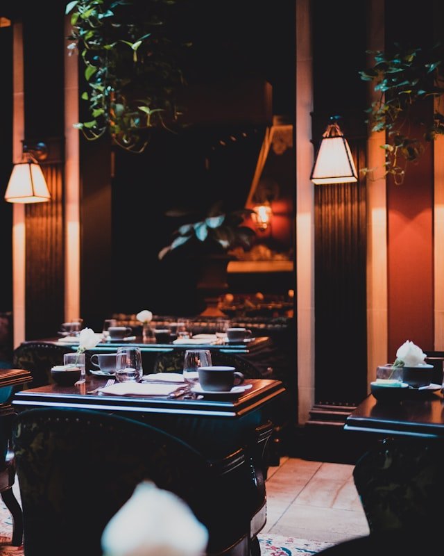 Dining room lit by warm table lamps